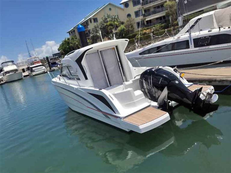 Mercury Engine Boat Parked Beside Another Boat Side View